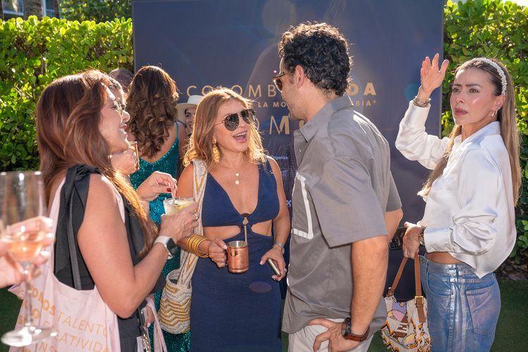 A photo of a crowd talking during Miami Swim Week 2024