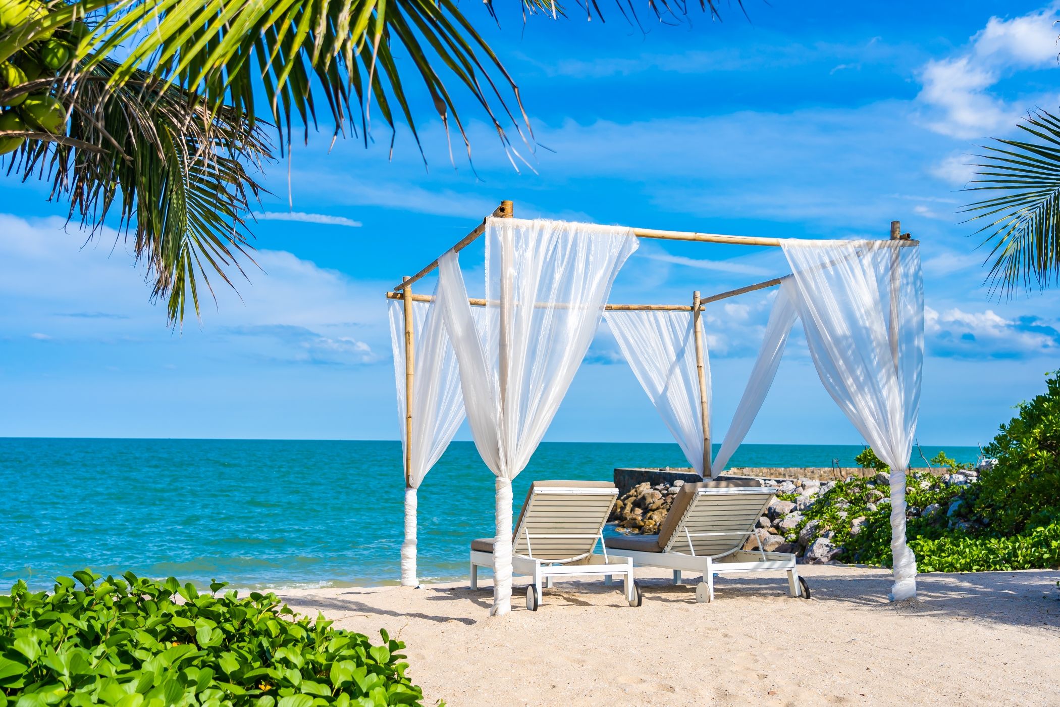 Beautiful spot just waiting for guests with two chairs and a pergola facing the ocean in Miami.